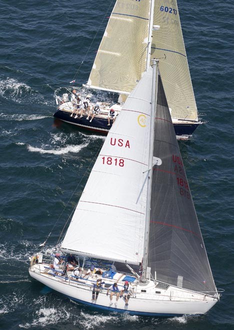 ’Sinn Fein’ a Cal 40 skippered by Peter S. Rebovich Sr. leads ’Frolic’, a Sabre 362 owned by Peter Brown, in class 1 of the St David’s Lighthouse at the start of the 635 mile Newport Bermuda Race  PHOTO CREDIT: Daniel Forster/PPL  - Newport Bermuda © Daniel Forster http://www.DanielForster.com
